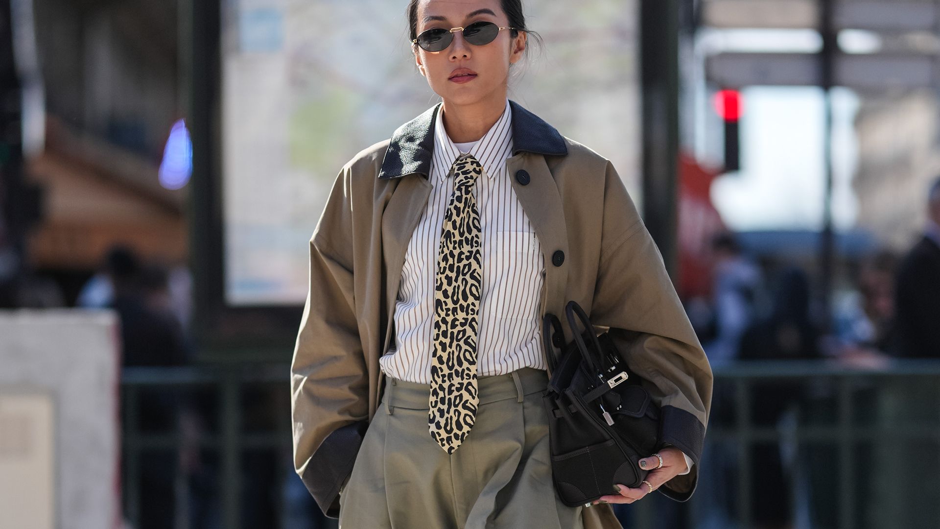Image may contain Clothing Coat Accessories Formal Wear Tie Adult Person Bag Handbag Jacket Glasses and Blazer