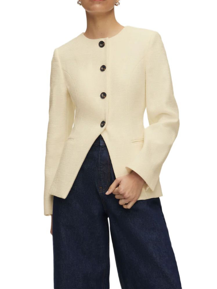 Image may contain Blazer Clothing Coat Jacket Knitwear and Sweater