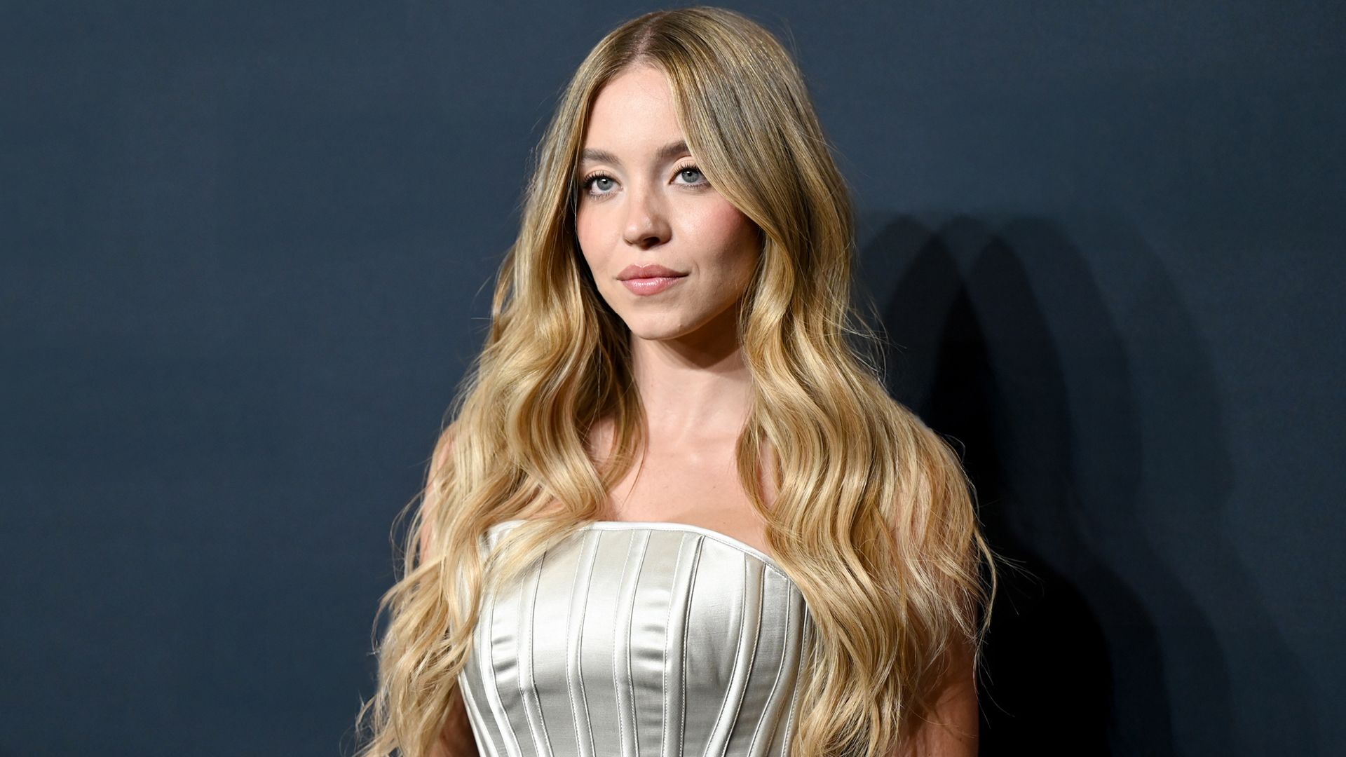Image may contain Sydney Sweeney Blonde Hair Person Face Head Photography Portrait Adult Happy and Smile