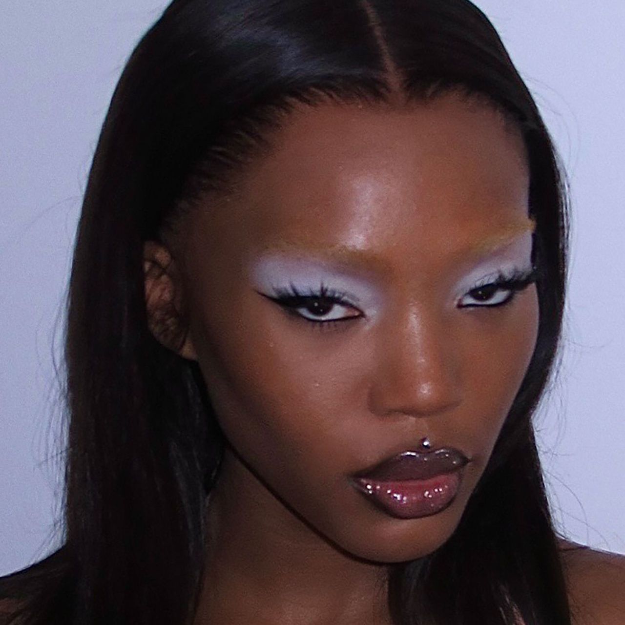 Image may contain Head Person Face Skin Adult Cosmetics and Lipstick