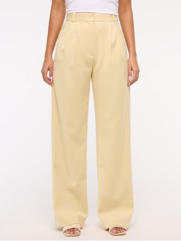 Image may contain Clothing Pants Home Decor Linen Skirt and Khaki