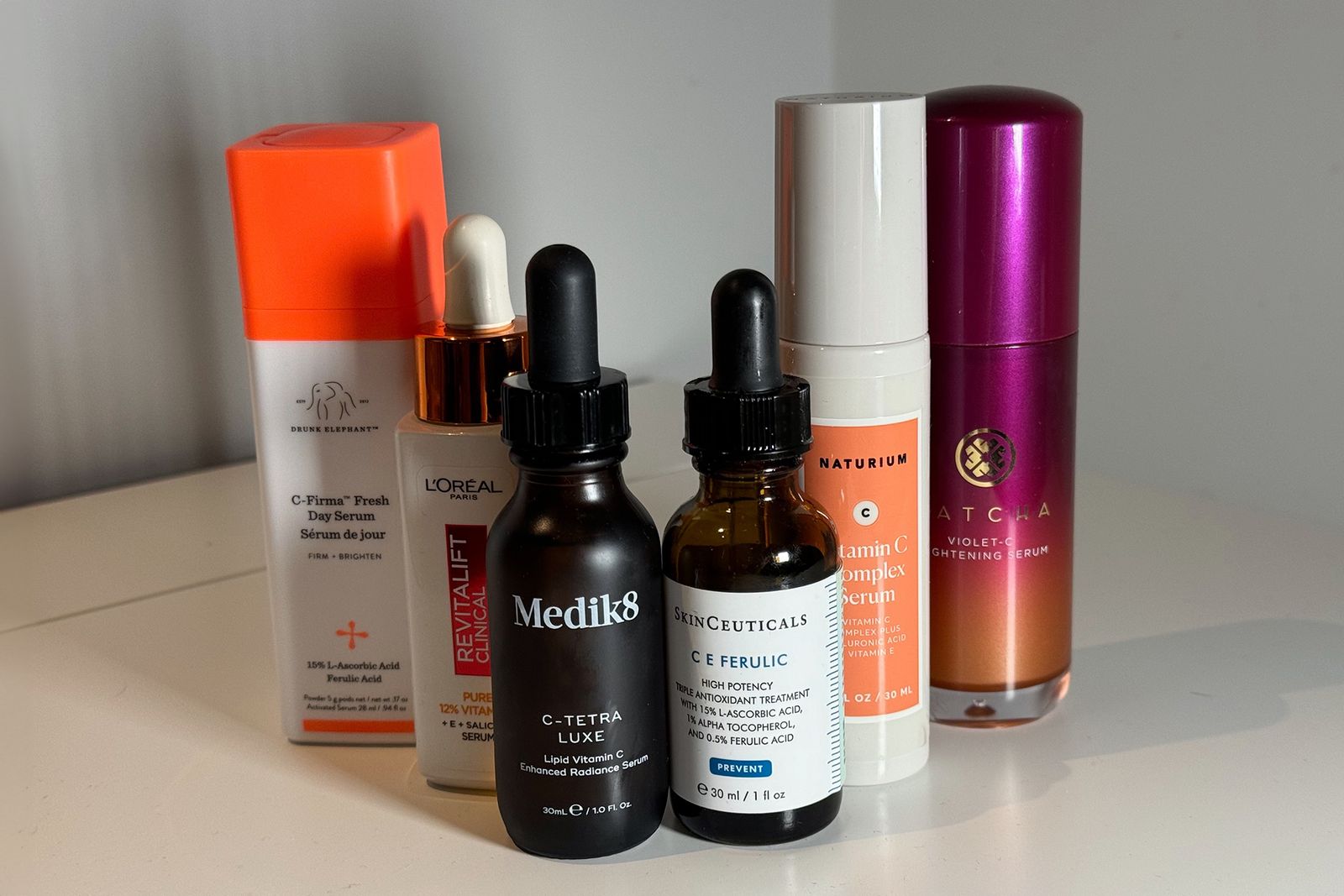 Image may contain Cosmetics Lipstick and Bottle